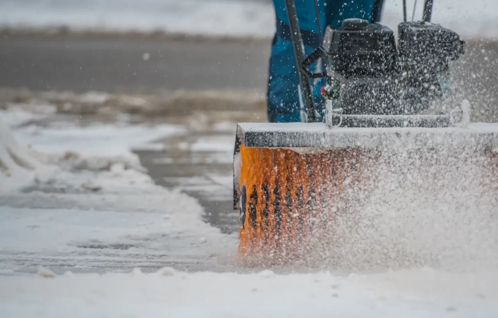 A member of ponderosa pathways clearing snow in flagstaff