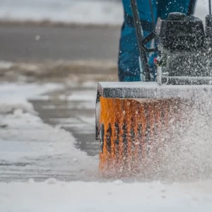 A member of ponderosa pathways clearing snow in flagstaff