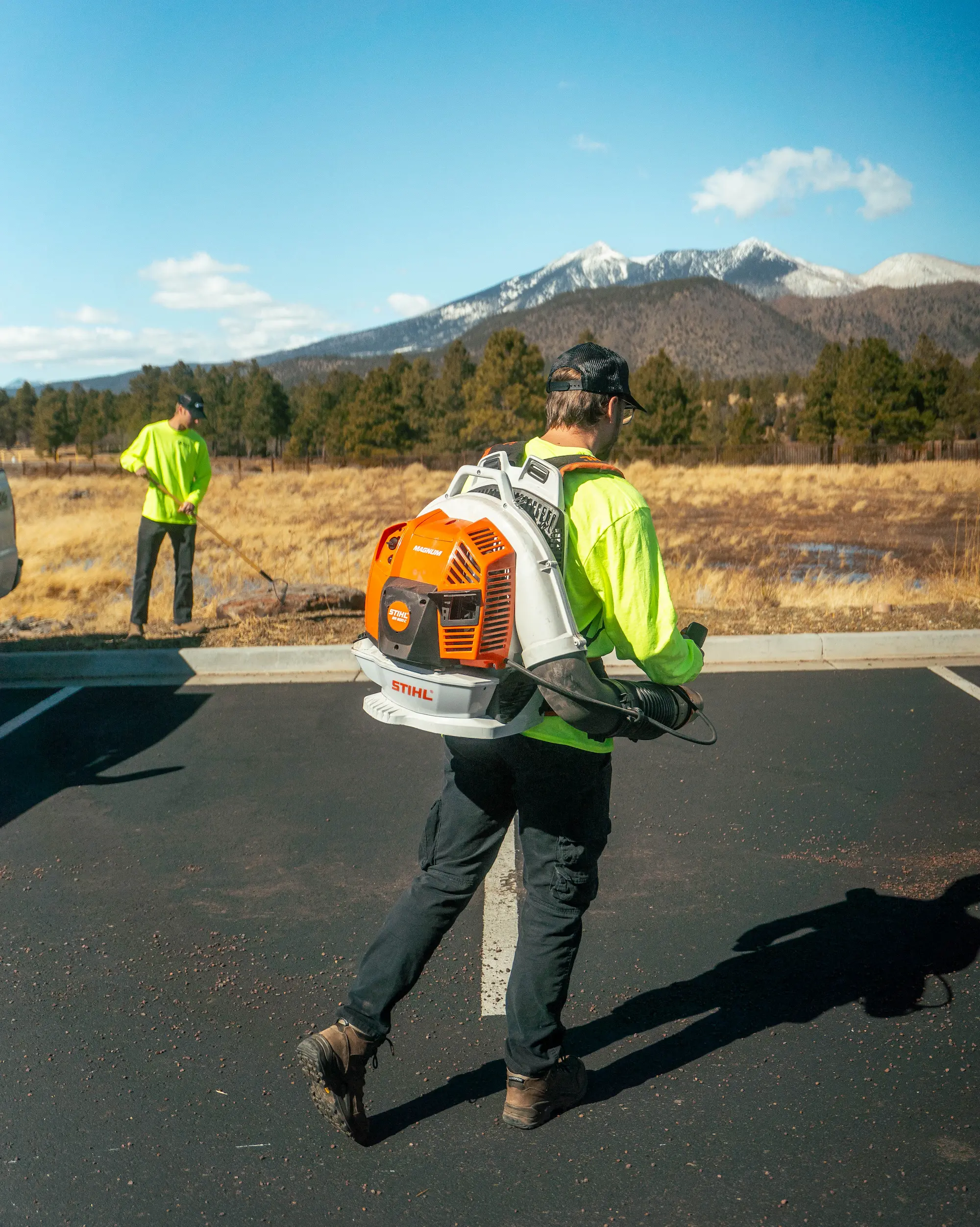 Ponderosa Pathways crew maintaining a commercial landscaping property in Flagstaff Arizona