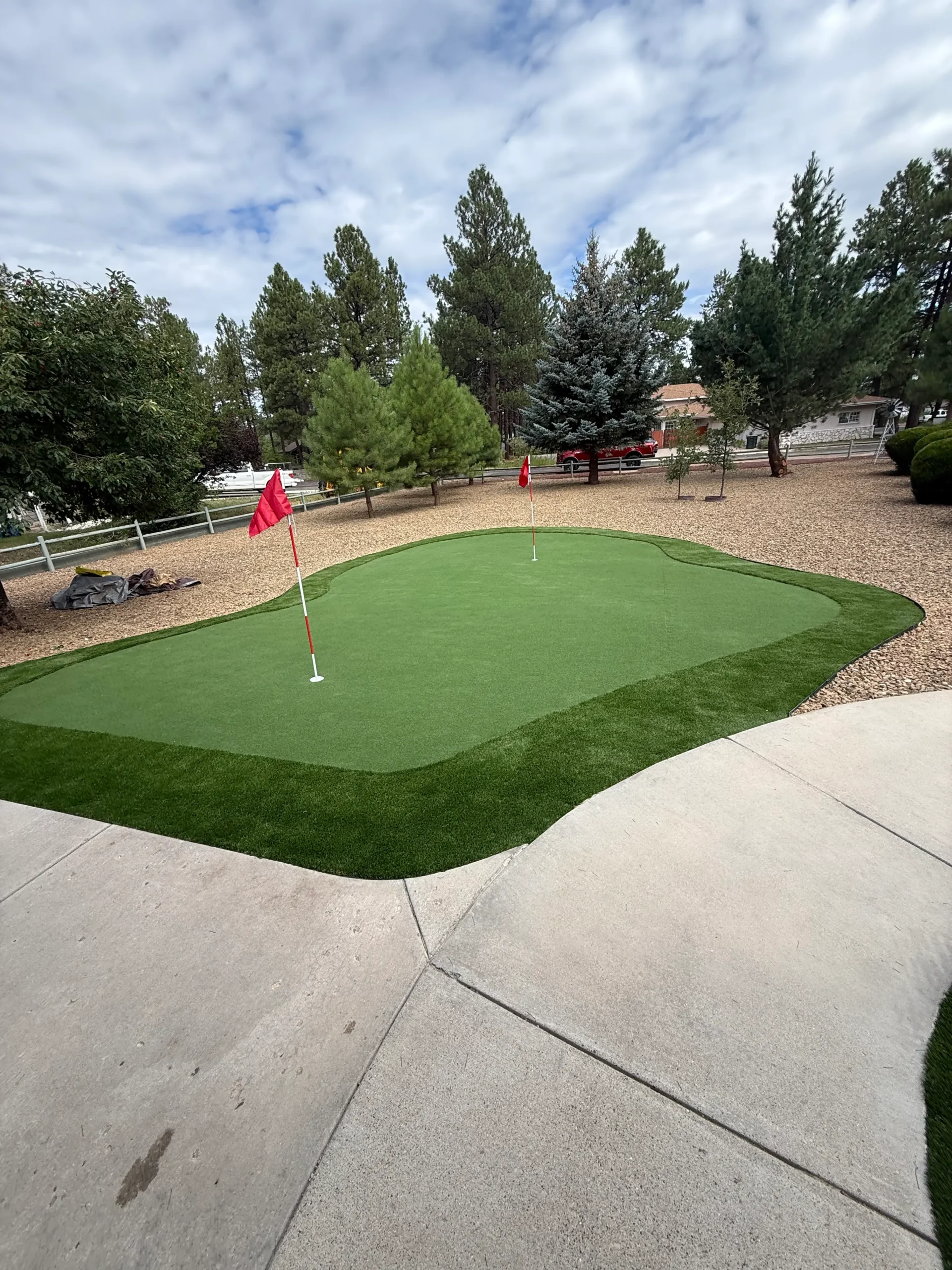 After landscaping — putting green with cinnamon gravel installed by Ponderosa Pathways in Flagstaff
