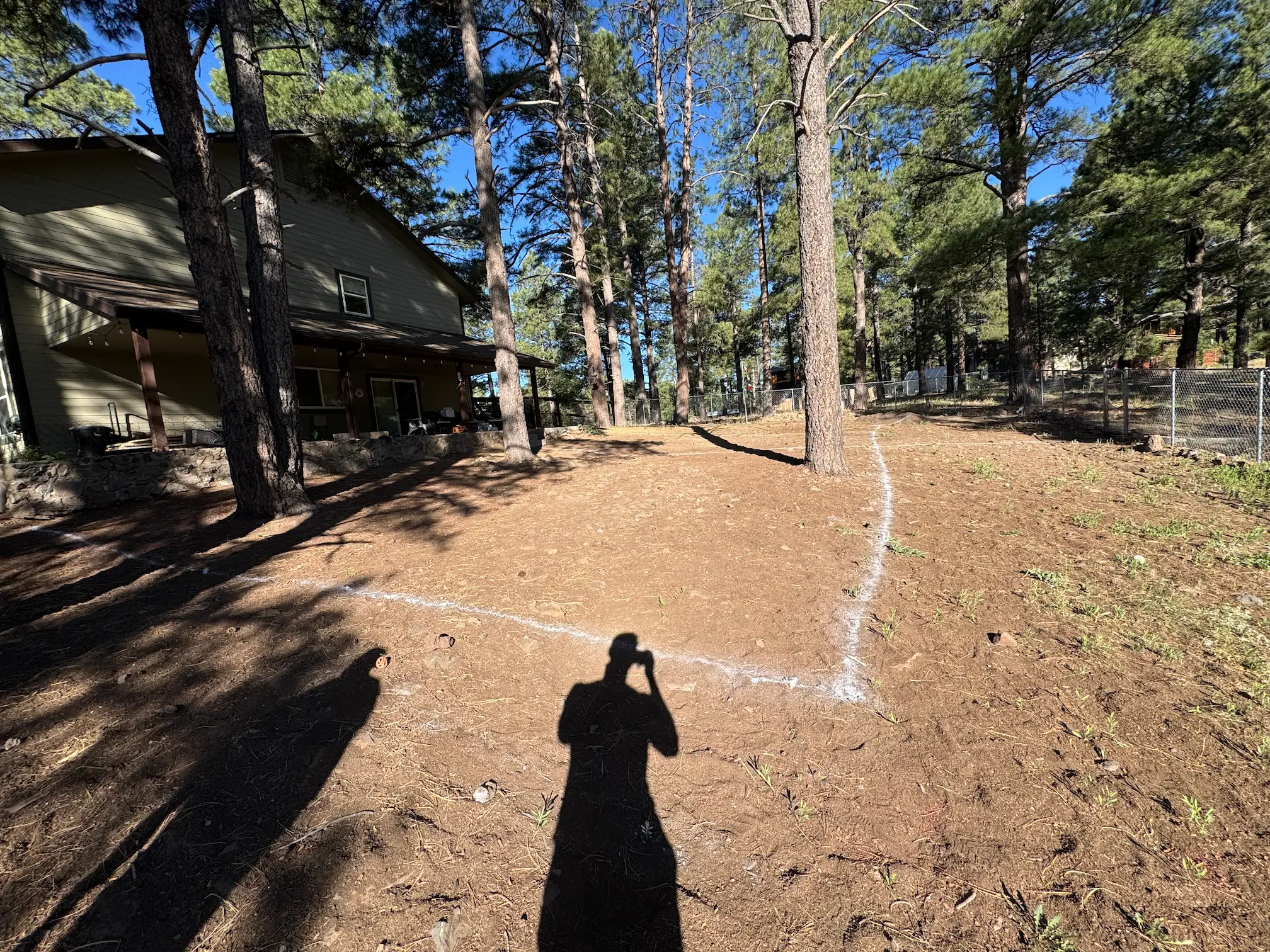 Before landscaping — rocky dirt yard in Flagstaff before Ponderosa Pathways install