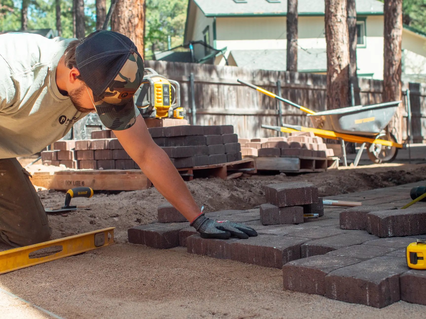 Completed Flagstaff residential landscaping project — front yard rock install and native plants by Ponderosa Pathways